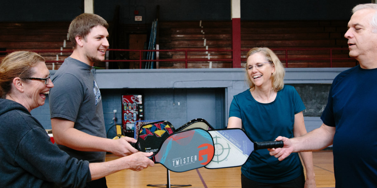 This is a group of people playing pickleball.