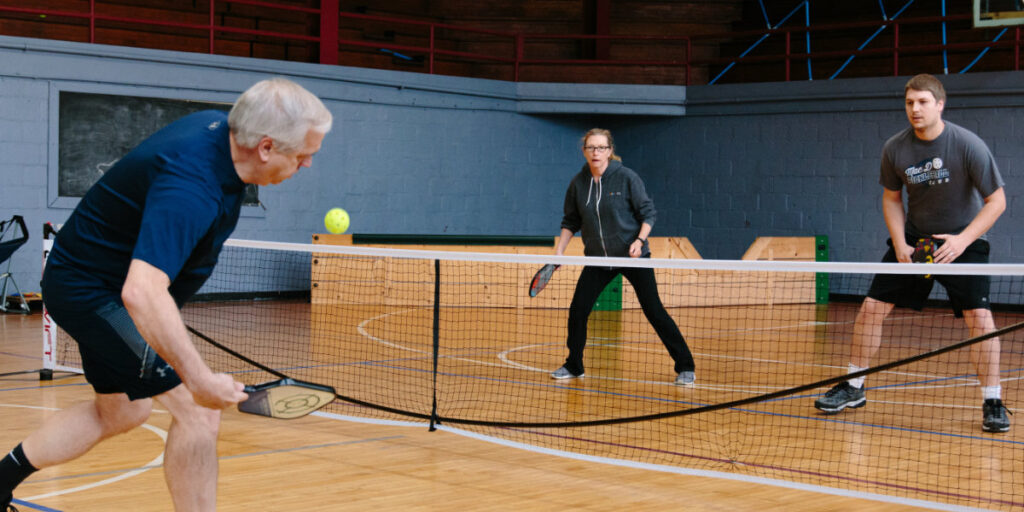 This is a group of people playing pickleball.