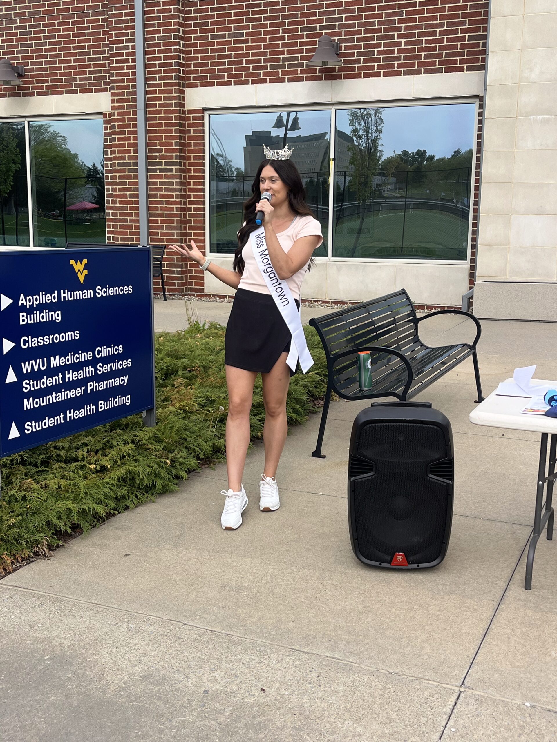 miss mountaineer speaking on her program with a microphone