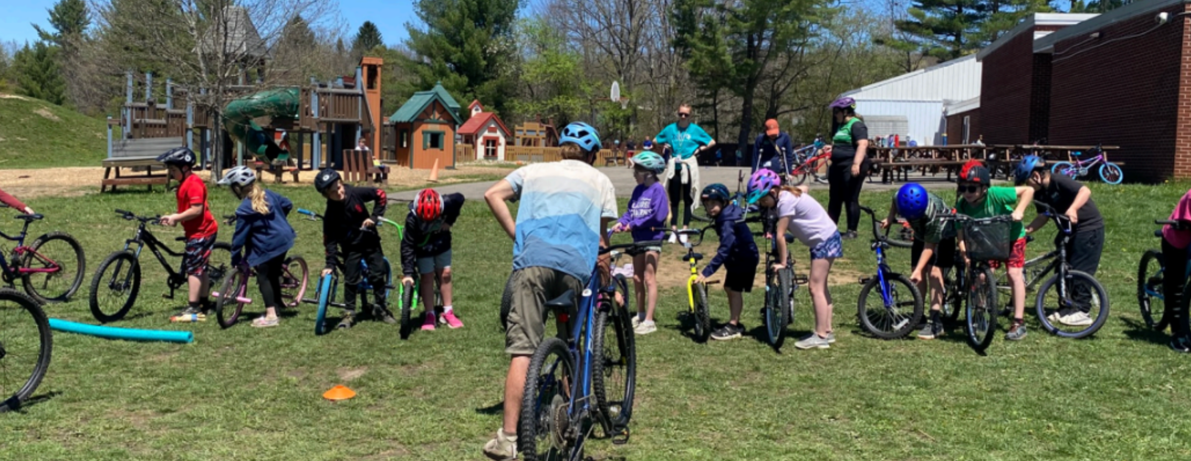 kids all lined up on bikes ready to go