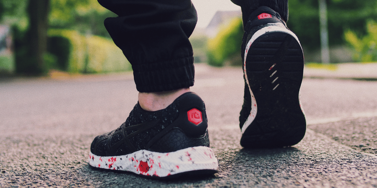 Close up shot of black tennis shoes walking