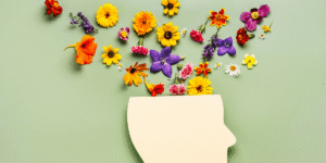 photo of a cutout of a head with flowers blooming out of the top